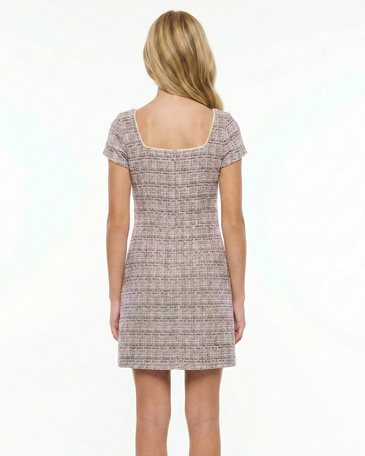 Girl in a boucle lilac dress with blonde hair.