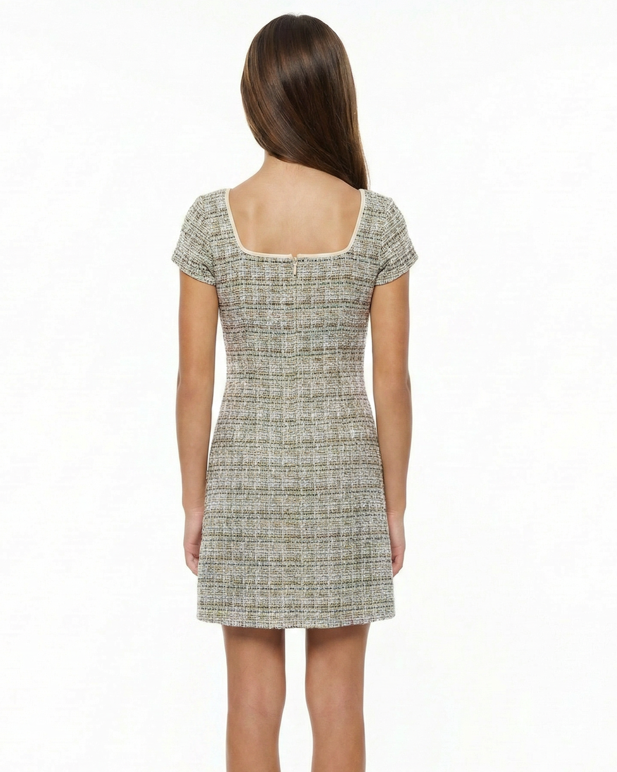Girl in a boucle multi dress with blonde hair.